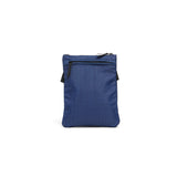 Mueslii crossbody,  made of water resistant canvas nylon, color ocean blue, back view.